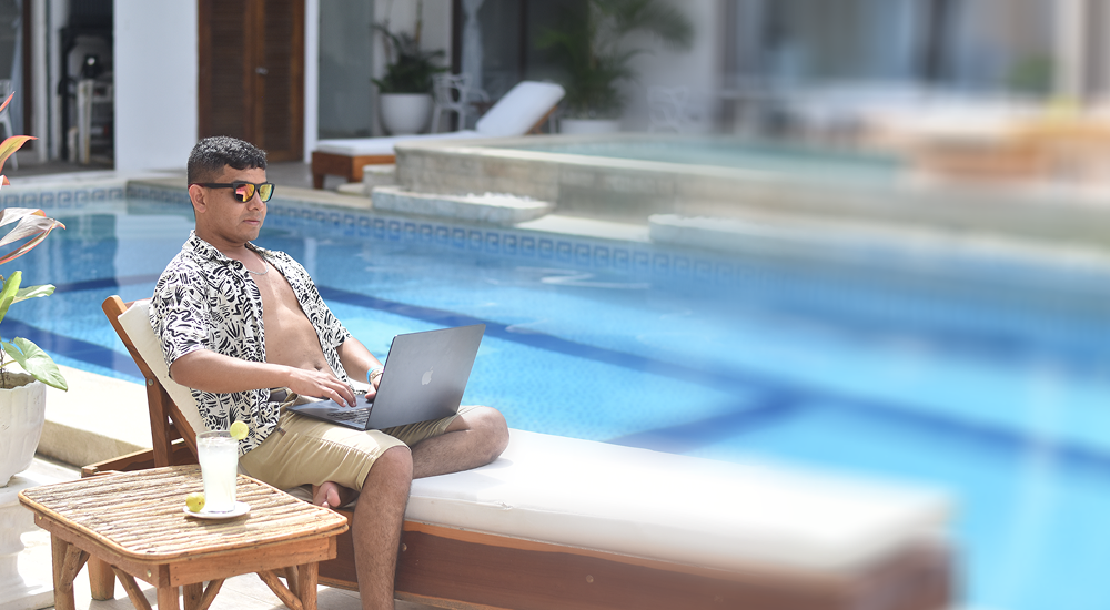 Julio working by the pool